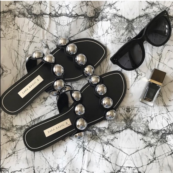 black slides with silver balls